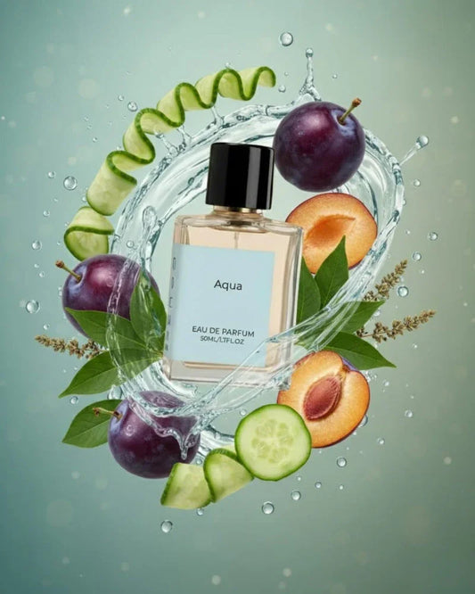 Aqua perfume bottle surrounded by fresh plums, cucumber slices, water splash, and green leaves